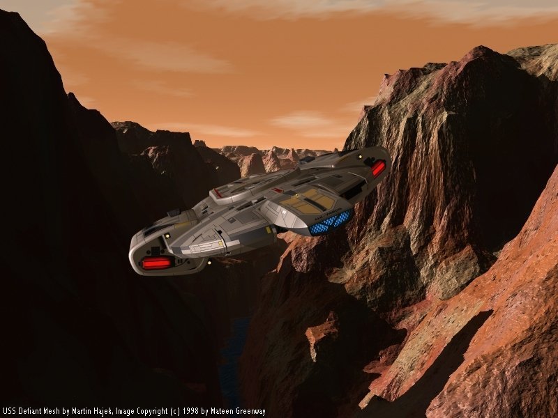 USS Defiant flying through canyon, free Star Trek and Deep Space Nine computer desktop wallpaper