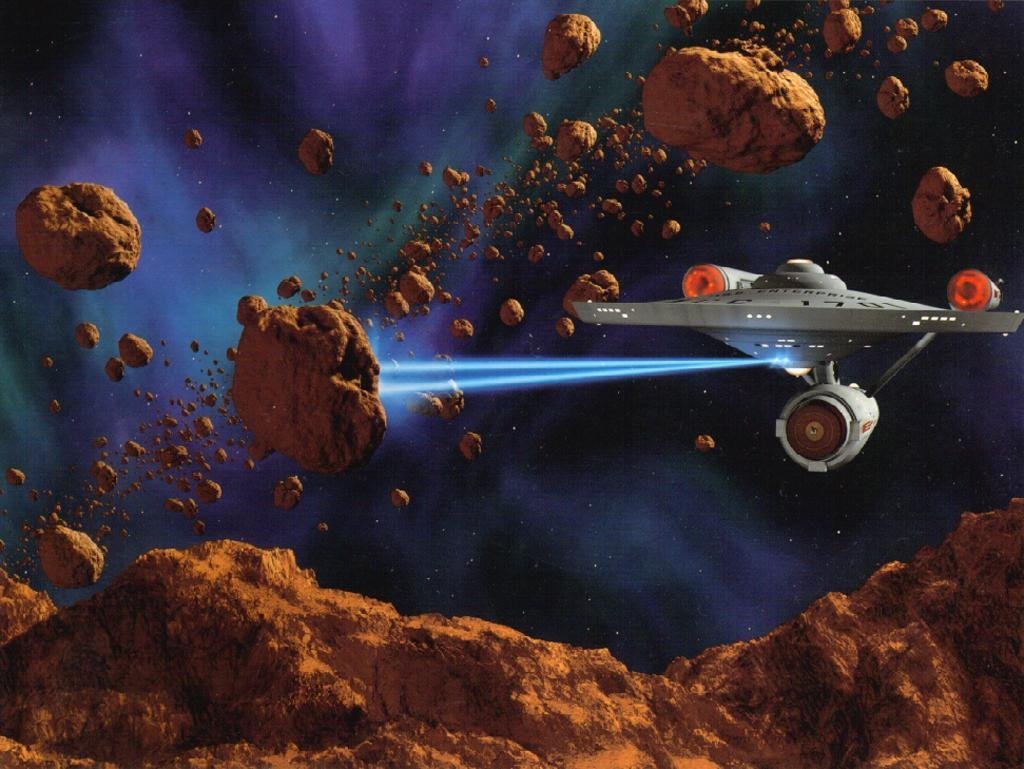 Starship Enterpise NCC 1701A firing phasers in asteroid field. Free Original Series Star Trek Computer Desktop Wallpaper